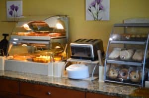 First Choice Inn's breakfast corner with a wide selection of pastries and breakfast items