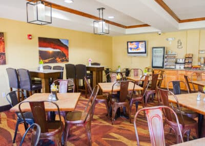 First Choice Inn's breakfast area with tables and chairs